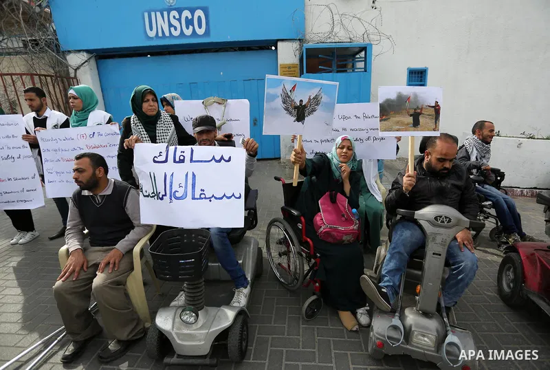 Disabled Palestinians take part in a protest against the killing of Ibraheem Abu Thuraya in front of the headquarter United Nation "UNESCO", in Gaza City, on December 21, 2017. Abu Thuraya, who was shot dead by Israeli s...