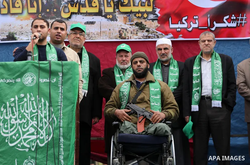 Palestinian supporters Hamas movement take part during a protest against U.S. President Donald Trump's decision to recognise Jerusalem as the capital of Israel, in Jabalia refugee camp in the northern Gaza strip on Decem...