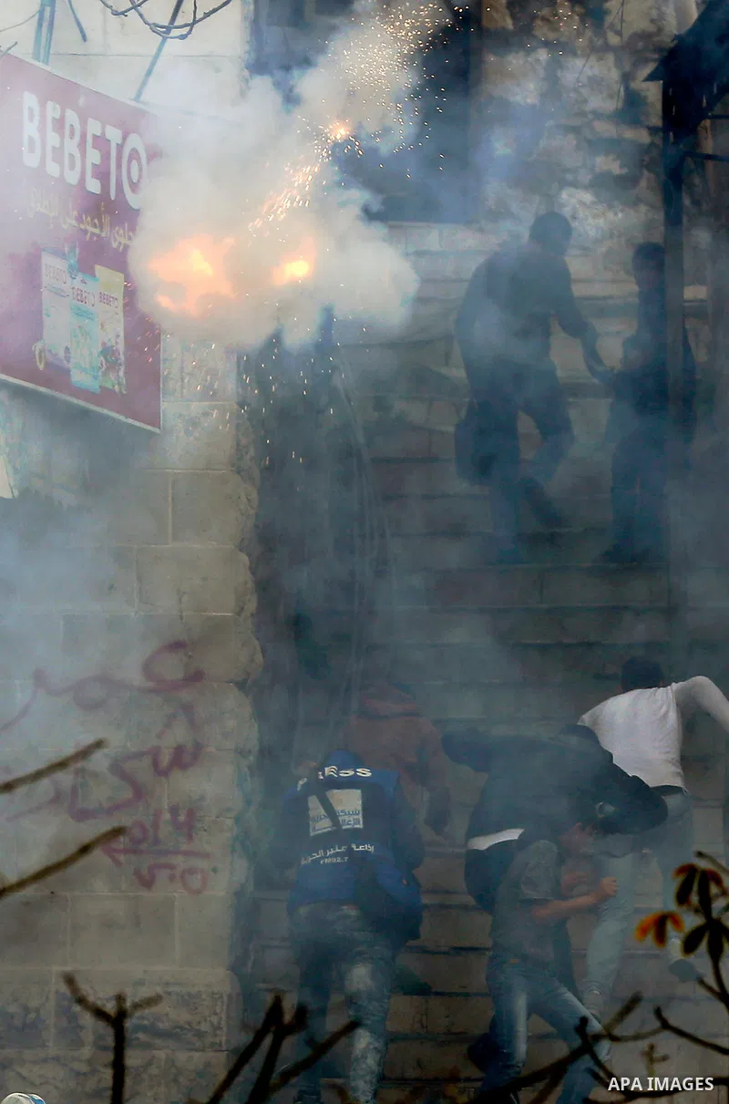 Palestinian protesters clash with Israeli security forces, at a protest as Palestinians call for a "Day of Rage" in response to U.S. President Donald Trump's recognition of Jerusalem as Israel's capital, in the West Bank...