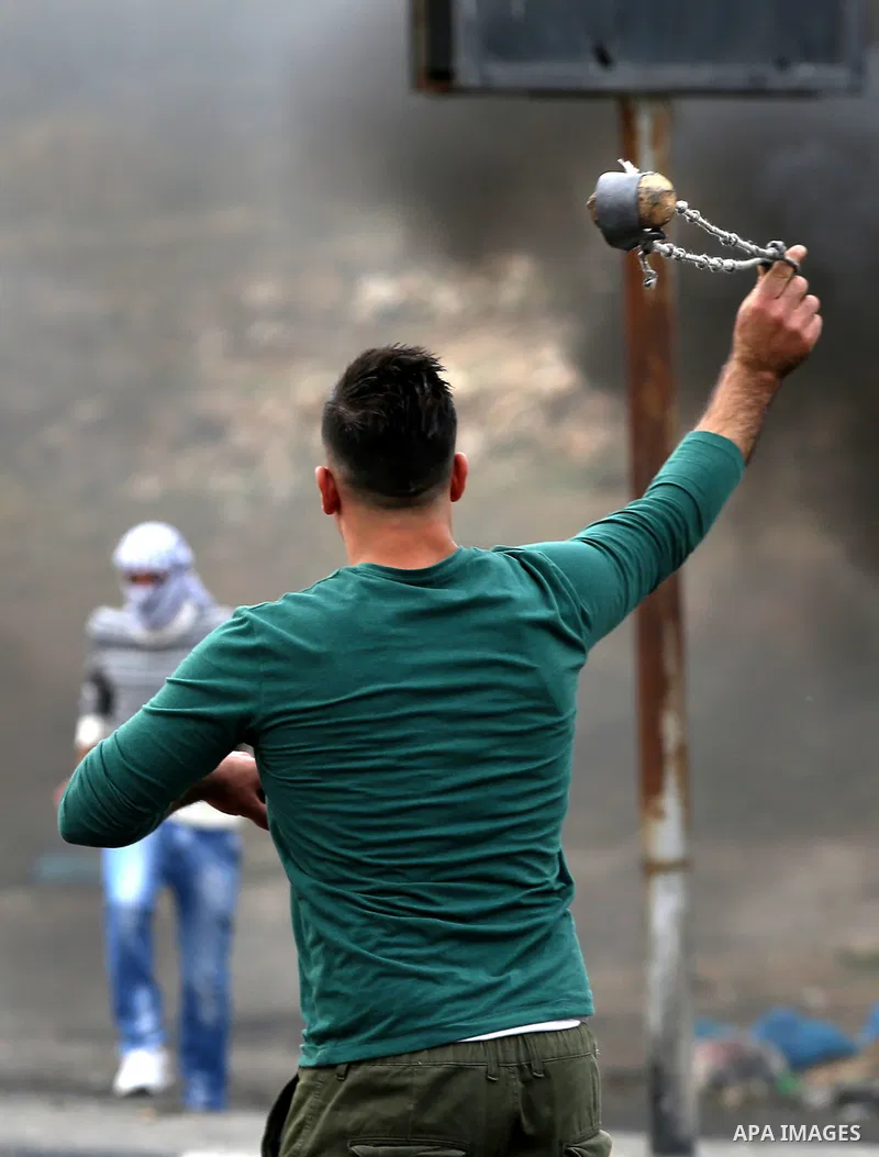 Palestinian protesters clash with Israeli security forces near the Huwara checkpoint south of Nablus in the Israeli-occupied West Bank, as Palestinians call for a "Day of Rage" in response to U.S. President Donald Trump'...