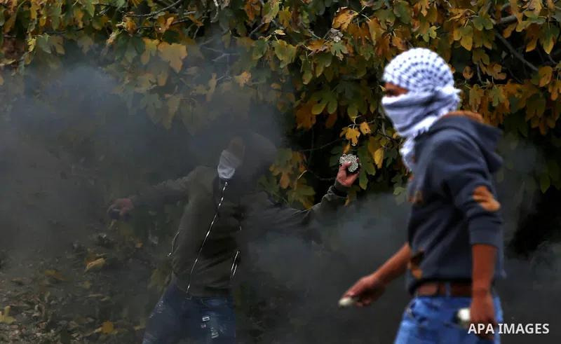 Palestinian protesters clash with Israeli security forces near the Huwara checkpoint south of Nablus in the Israeli-occupied West Bank, as Palestinians call for a "Day of Rage" in response to U.S. President Donald Trump'...