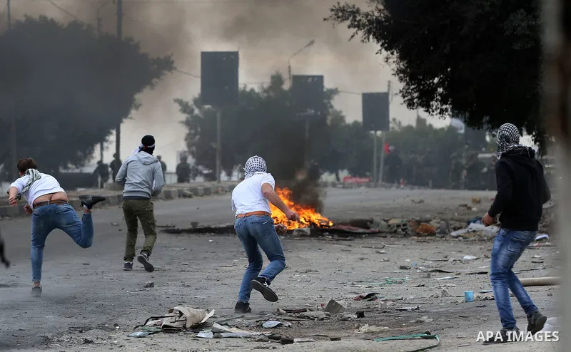 Palestinian protesters clash with Israeli security forces near the Huwara checkpoint south of Nablus in the Israeli-occupied West Bank, as Palestinians call for a "Day of Rage" in response to U.S. President Donald Trump'...