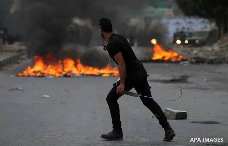Palestinian protesters clash with Israeli security forces near the Huwara checkpoint south of Nablus in the Israeli-occupied West Bank, as Palestinians call for a "Day of Rage" in response to U.S. President Donald Trump'...