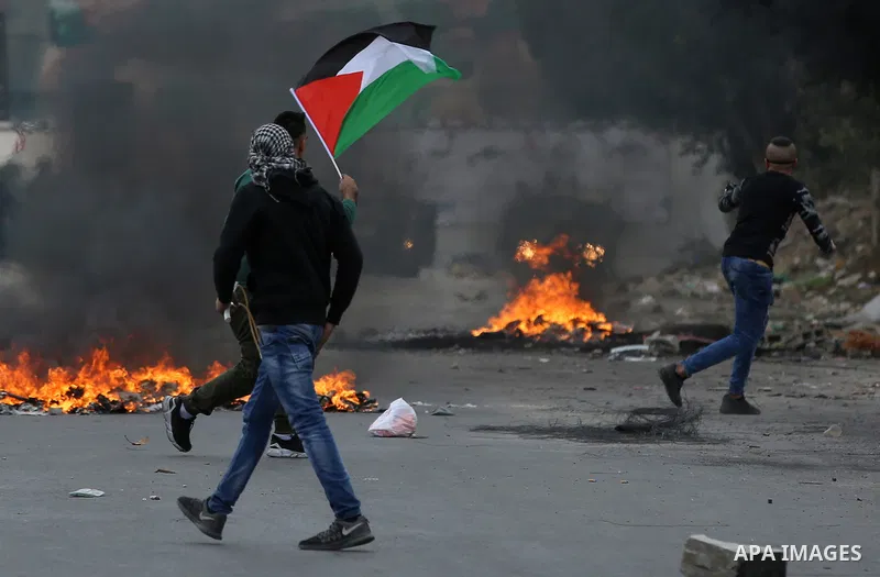 Palestinian protesters clash with Israeli security forces near the Huwara checkpoint south of Nablus in the Israeli-occupied West Bank, as Palestinians call for a "Day of Rage" in response to U.S. President Donald Trump'...