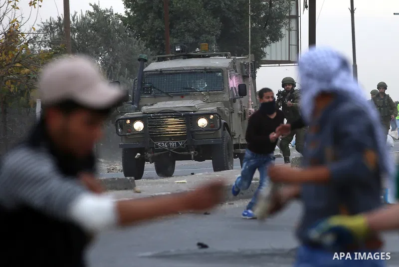 Palestinian protesters clash with Israeli security forces near the Huwara checkpoint south of Nablus in the Israeli-occupied West Bank, as Palestinians call for a "Day of Rage" in response to U.S. President Donald Trump'...