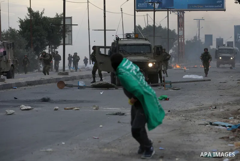 Palestinian protesters clash with Israeli security forces near the Huwara checkpoint south of Nablus in the Israeli-occupied West Bank, as Palestinians call for a "Day of Rage" in response to U.S. President Donald Trump'...