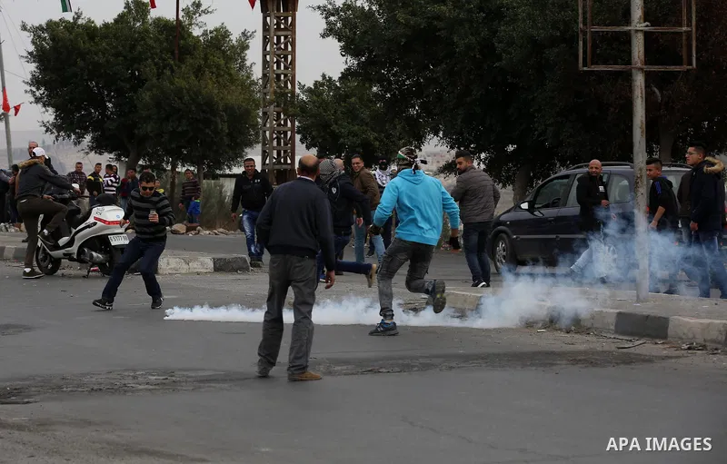 Palestinian protesters clash with Israeli security forces near the Huwara checkpoint south of Nablus in the Israeli-occupied West Bank, as Palestinians call for a "Day of Rage" in response to U.S. President Donald Trump'...
