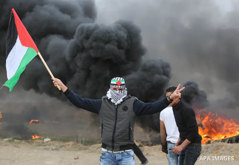 Palestinian protesters clash with Israeli security forces, at a protest as Palestinians call for a "Day of Rage" in response to U.S. President Donald Trump's recognition of Jerusalem as Israel's capital, near the border...