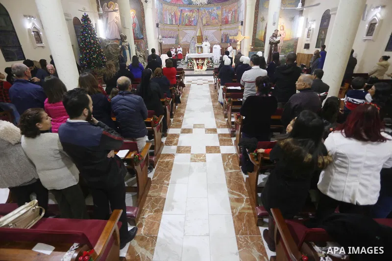 Palestinian Christians attend a Sunday mass on Christmas Eve at the Der Latin church in Gaza City, 24 December 2017. Photo by Mohammed Asad