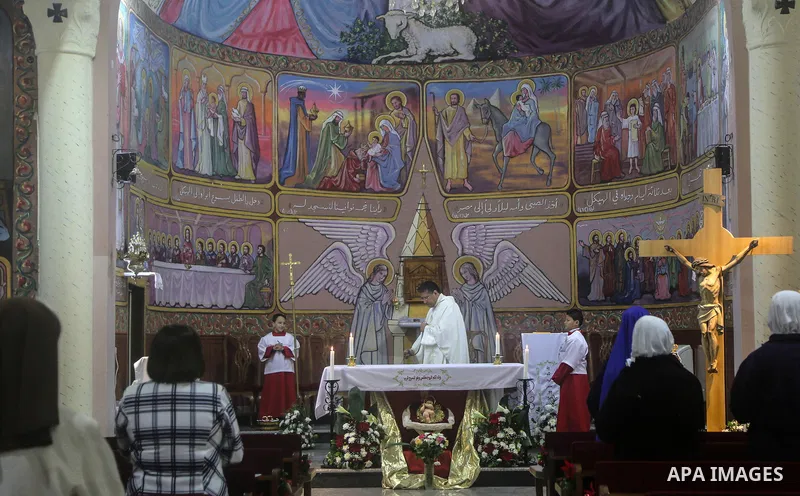 Nuns of the Missionaries of Charity order attend Christmas day mass at the Roman Catholic Church of Holy Family in Gaza City on December 25, 2017. Photo by Mohammed Dahman