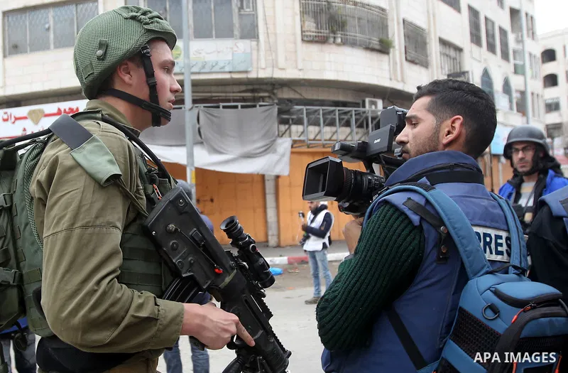 Palestinian photographers scuffles with Israeli security forces in the occupied West Bank city of Hebron on December 29, 2017 as protests continue over US President Donald Trump's declaration of Jerusalem as Israel's cap...