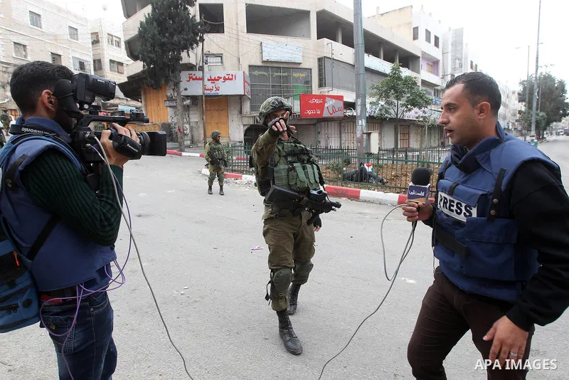 Palestinian photographers scuffles with Israeli security forces in the occupied West Bank city of Hebron on December 29, 2017 as protests continue over US President Donald Trump's declaration of Jerusalem as Israel's cap...