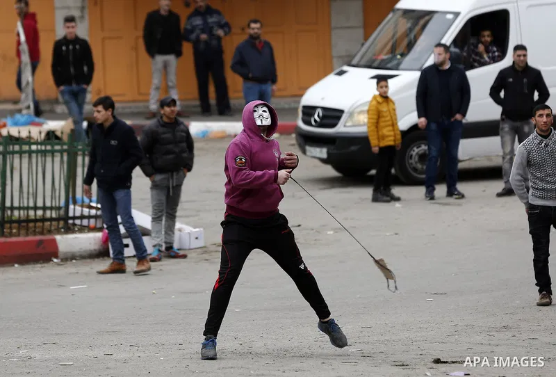 Palestinian demonstrators clash with Israeli security forces in the occupied West Bank city of Hebron on December 29, 2017 as protests continue over US President Donald Trump's declaration of Jerusalem as Israel's capita...