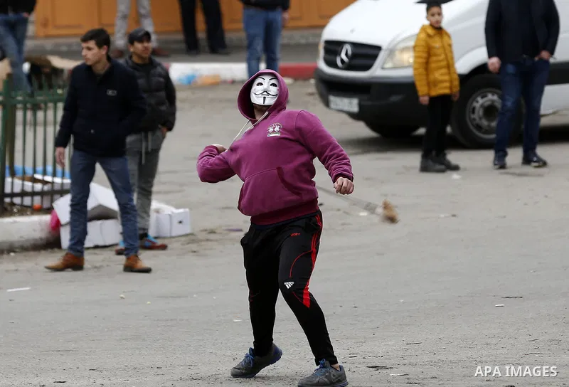Palestinian demonstrators clash with Israeli security forces in the occupied West Bank city of Hebron on December 29, 2017 as protests continue over US President Donald Trump's declaration of Jerusalem as Israel's capita...