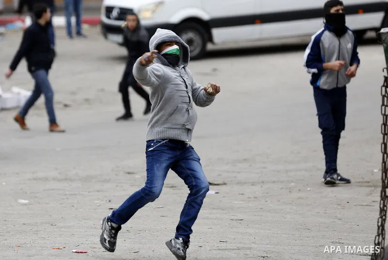 Palestinian demonstrators clash with Israeli security forces in the occupied West Bank city of Hebron on December 29, 2017 as protests continue over US President Donald Trump's declaration of Jerusalem as Israel's capita...