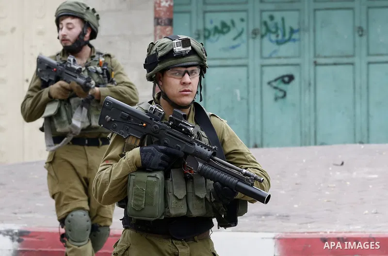 Israeli security forces take position during clashes with Palestinian protesters in the occupied West Bank city of Hebron on December 29, 2017 as protests continue over US President Donald Trump's declaration of Jerusale...