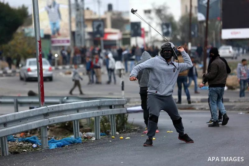 Palestinian protesters clash with Israeli security forces as protests continue over US President Donald Trump's declaration of Jerusalem as Israel's capital at Hawara checkpoint, south of the West Bank city of Nablus on...