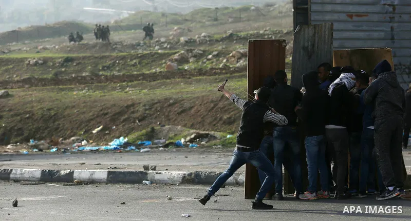 Palestinian protesters clash with Israeli security forces as protests continue over US President Donald Trump's declaration of Jerusalem as Israel's capital at Hawara checkpoint, south of the West Bank city of Nablus on...