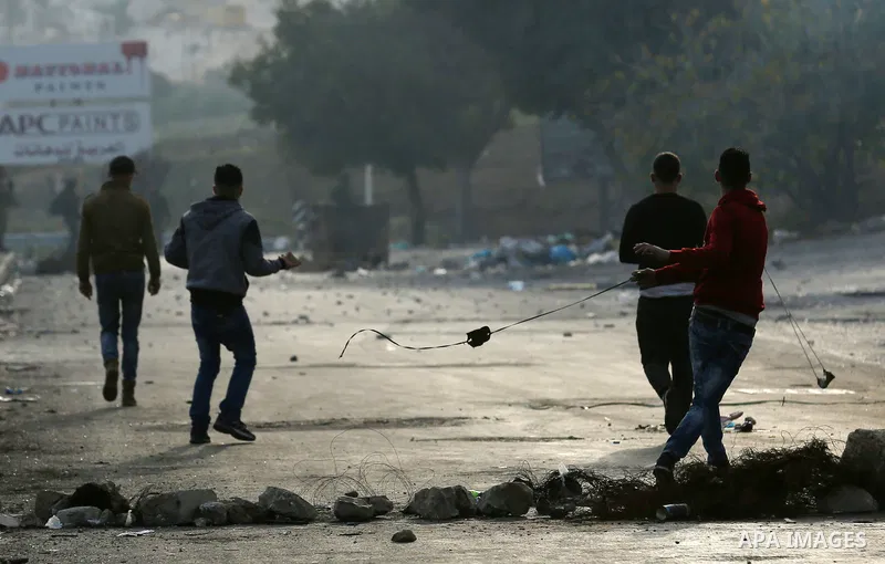 Palestinian protesters clash with Israeli security forces as protests continue over US President Donald Trump's declaration of Jerusalem as Israel's capital at Hawara checkpoint, south of the West Bank city of Nablus on...