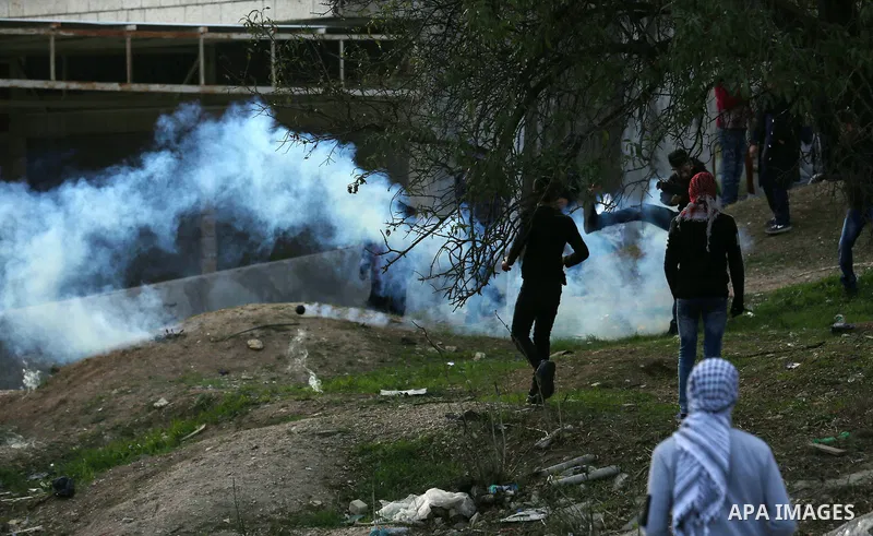 Palestinian protesters clash with Israeli security forces as protests continue over US President Donald Trump's declaration of Jerusalem as Israel's capital at Hawara checkpoint, south of the West Bank city of Nablus on...
