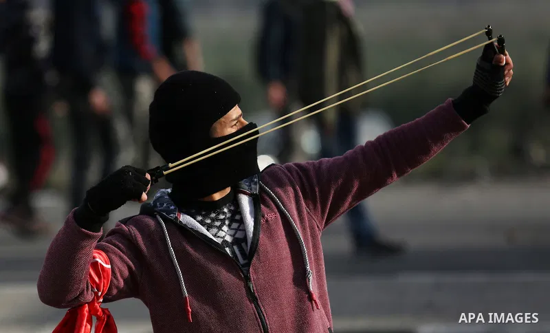 Palestinian protesters clash with Israeli security forces as protests continue over US President Donald Trump's declaration of Jerusalem as Israel's capital at Hawara checkpoint, south of the West Bank city of Nablus on...