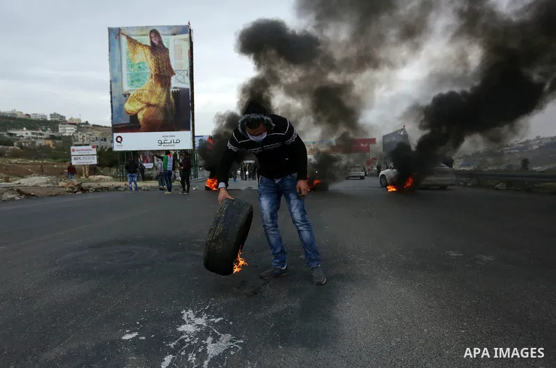 Palestinian protesters clash with Israeli security forces as protests continue over US President Donald Trump's declaration of Jerusalem as Israel's capital at Hawara checkpoint, south of the West Bank city of Nablus on...