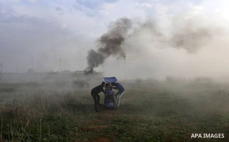 A wounded Palestinian demonstrator is evacuated during clashes with Israeli security forces near the Israel-Gaza border east of Gaza City on December 29, 2017, as demonstrations continue over the US president's controver...