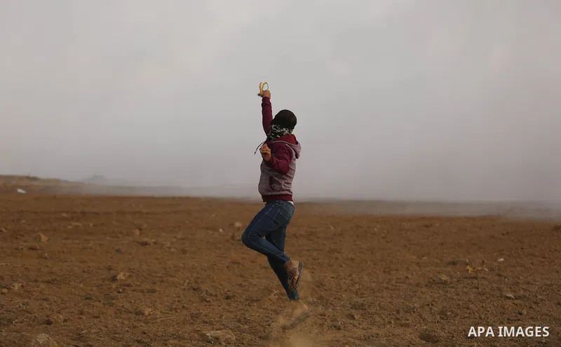 Palestinian protesters clash with Israeli security forces near the border with Israel in the southern Gaza Strip on December 29, 2017, as demonstrations continue over the US president's controversial recognition of Jerus...