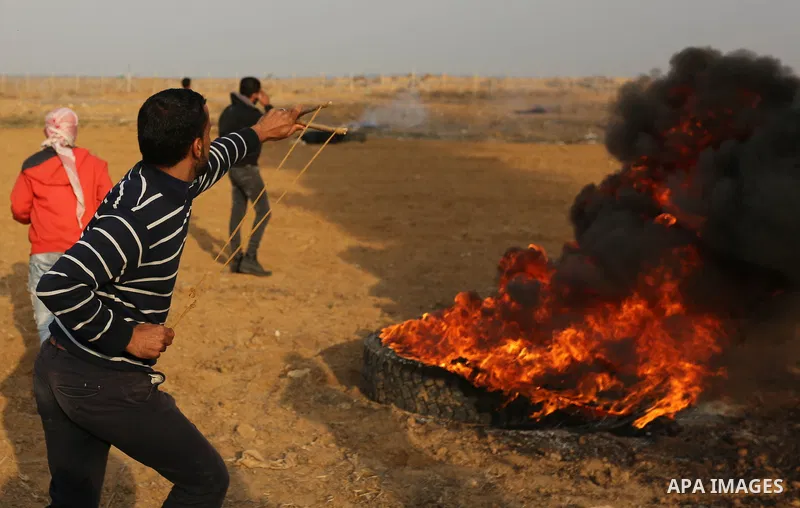 Palestinian protesters clash with Israeli security forces near the border with Israel in the southern Gaza Strip on December 29, 2017, as demonstrations continue over the US president's controversial recognition of Jerus...