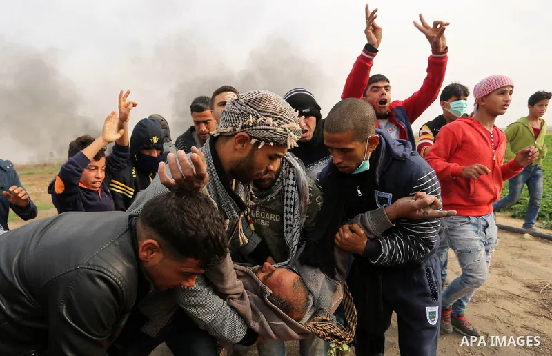 A wounded Palestinian protester is evacuated during clashes with Israeli security forces near the border with Israel in the southern Gaza Strip on December 29, 2017, as demonstrations continue over the US president's con...
