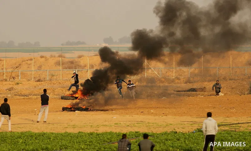 Palestinian protesters clash with Israeli security forces near the border with Israel in the southern Gaza Strip on December 29, 2017, as demonstrations continue over the US president's controversial recognition of Jerus...