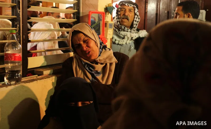 Relatives of Palestinian Jamal Mesleh, who died of his injuries during clashes with Israeli security forces on Friday mourn during his funeral, in the al-Maghazi refugee camp in the central Gaza Strip December 30, 2017....