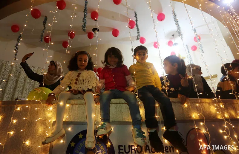 Palestinian children celebrate of New Year festivities, in Gaza City, on December 30, 2017. Photo by Mohammed Asad