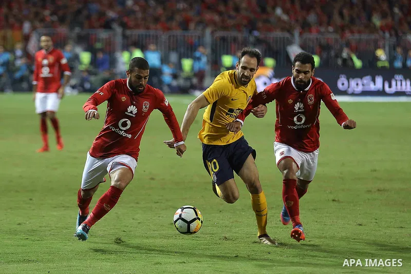 Egypt's Al-Ahly and Spain's Atletico Madrid players compete during the friendly football match at Borg al-Arab Stadium, near Alexandria, on December 30, 2017. Photo by Stringer