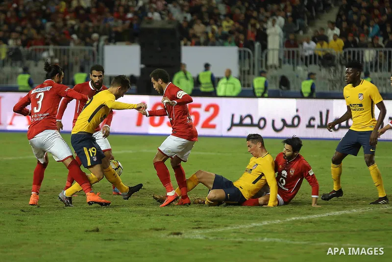 Egypt's Al-Ahly and Spain's Atletico Madrid players compete during the friendly football match at Borg al-Arab Stadium, near Alexandria, on December 30, 2017. Photo by Stringer