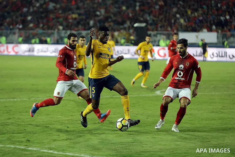 Egypt's Al-Ahly and Spain's Atletico Madrid players compete during the friendly football match at Borg al-Arab Stadium, near Alexandria, on December 30, 2017. Photo by Stringer