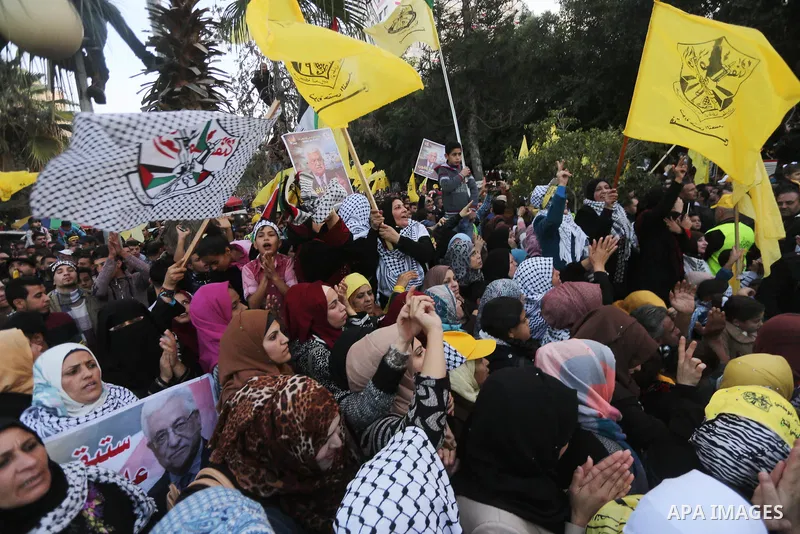 Palestinian supporters of the Fatah movement take part during a rally in Gaza City on December 31, 2017, marking the 53rd anniversary of the creation of the political party. Photo by Mohammed Asad