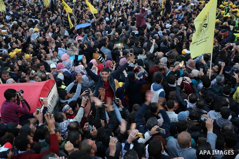 Palestinian supporters of the Fatah movement take part during a rally in Gaza City on December 31, 2017, marking the 53rd anniversary of the creation of the political party. Photo by Ashraf Amra