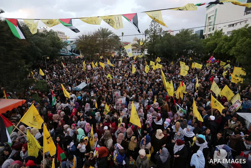 Palestinian supporters of the Fatah movement take part during a rally in Gaza City on December 31, 2017, marking the 53rd anniversary of the creation of the political party. Photo by Ashraf Amra