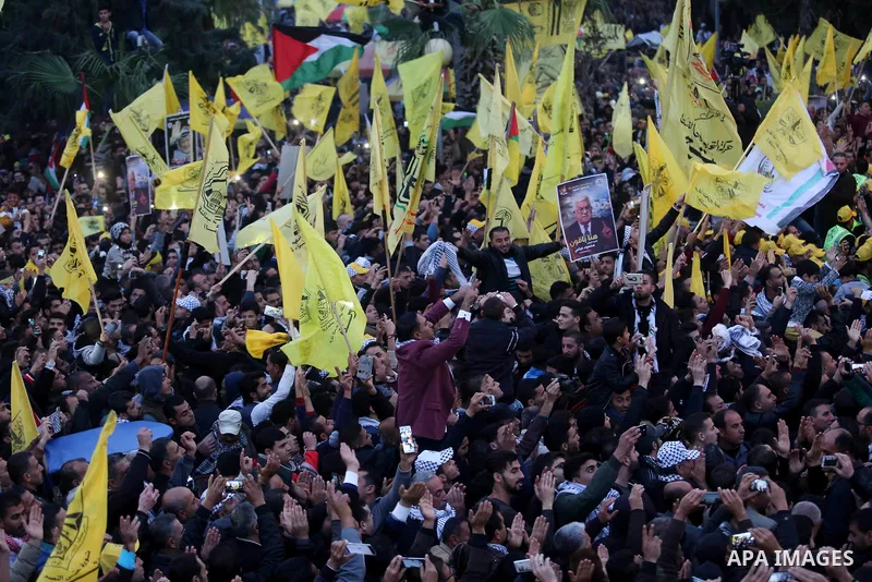 Palestinian supporters of the Fatah movement take part during a rally in Gaza City on December 31, 2017, marking the 53rd anniversary of the creation of the political party. Photo by Ashraf Amra