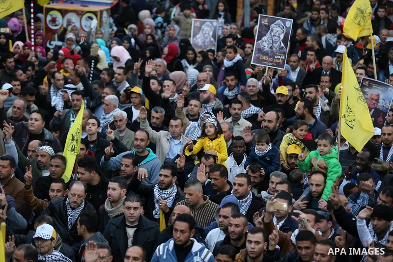 Palestinian supporters of the Fatah movement take part during a rally in Gaza City on December 31, 2017, marking the 53rd anniversary of the creation of the political party. Photo by Ashraf Amra