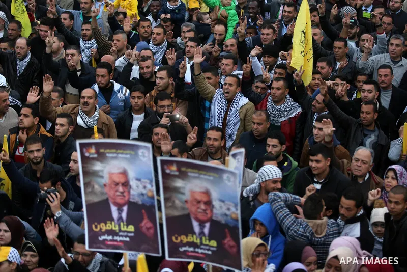 Palestinian supporters of the Fatah movement take part during a rally in Gaza City on December 31, 2017, marking the 53rd anniversary of the creation of the political party. Photo by Ashraf Amra