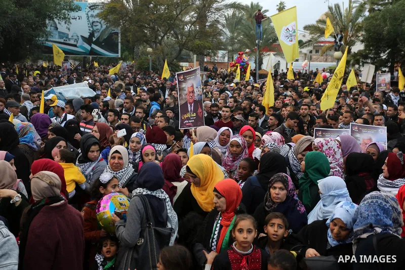 Palestinian supporters of the Fatah movement take part during a rally in Gaza City on December 31, 2017, marking the 53rd anniversary of the creation of the political party. Photo by Ashraf Amra