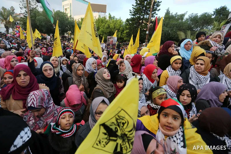 Palestinian supporters of the Fatah movement take part during a rally in Gaza City on December 31, 2017, marking the 53rd anniversary of the creation of the political party. Photo by Ashraf Amra
