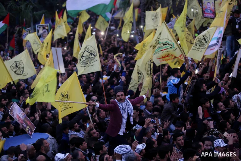 Palestinian supporters of the Fatah movement take part during a rally in Gaza City on December 31, 2017, marking the 53rd anniversary of the creation of the political party. Photo by Ashraf Amra