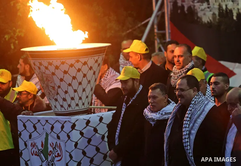 Palestinian supporters of the Fatah movement take part during a rally in Gaza City on December 31, 2017, marking the 53rd anniversary of the creation of the political party. Photo by Ashraf Amra