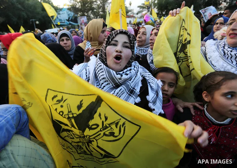 Palestinian supporters of the Fatah movement take part during a rally in Gaza City on December 31, 2017, marking the 53rd anniversary of the creation of the political party. Photo by Ashraf Amra