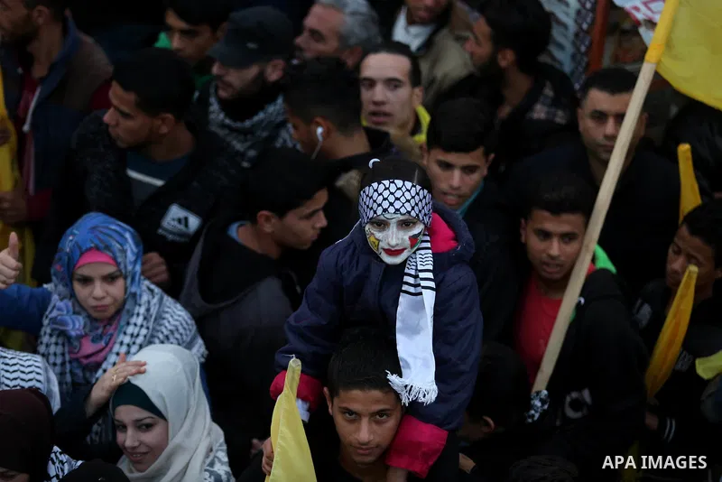 Palestinian supporters of the Fatah movement take part during a rally in Gaza City on December 31, 2017, marking the 53rd anniversary of the creation of the political party. Photo by Ashraf Amra