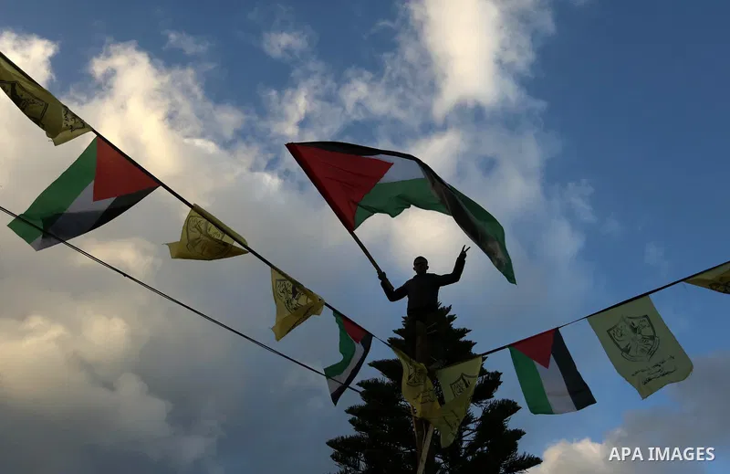Palestinian supporters of the Fatah movement take part during a rally in Gaza City on December 31, 2017, marking the 53rd anniversary of the creation of the political party. Photo by Ashraf Amra