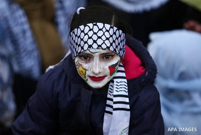 Palestinian supporters of the Fatah movement take part during a rally in Gaza City on December 31, 2017, marking the 53rd anniversary of the creation of the political party. Photo by Ashraf Amra